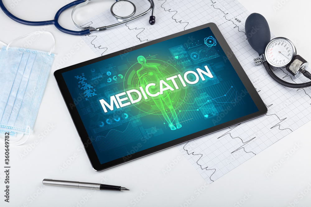 Tablet pc and doctor tools with MEDICATION inscription, coronavirus concept Tablet pc and doctor tools with MEDICATION inscription, coronavirus concept