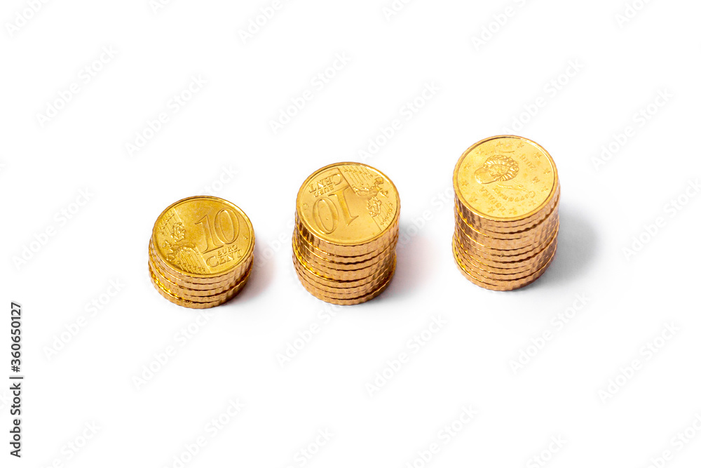 Golden Cents, Euros, stocked in 3 piles separated. From above Golden Cents, Euros, stocked in 3 piles separated. From above
