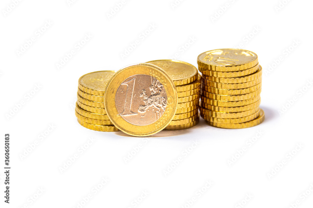 Cents, Euros, stocked in 3 piles close together with one euro coin on the front. from the front Cents, Euros, stocked in 3 piles close together with one euro coin on the front. from the front