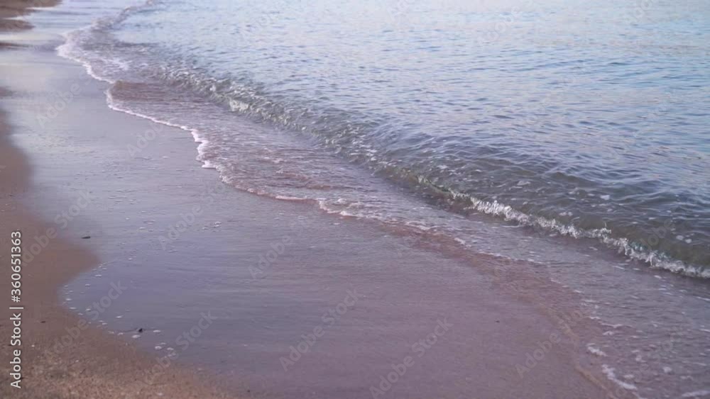 Stock slow motion video of the waves of the sea in the sunset. Concept of climate crisis and refugee crisis in the Mediterranean Sea. Stock slow motion video of the waves of the sea in the sunset. Concept of climate crisis and refugee crisis in the Mediterranean Sea.