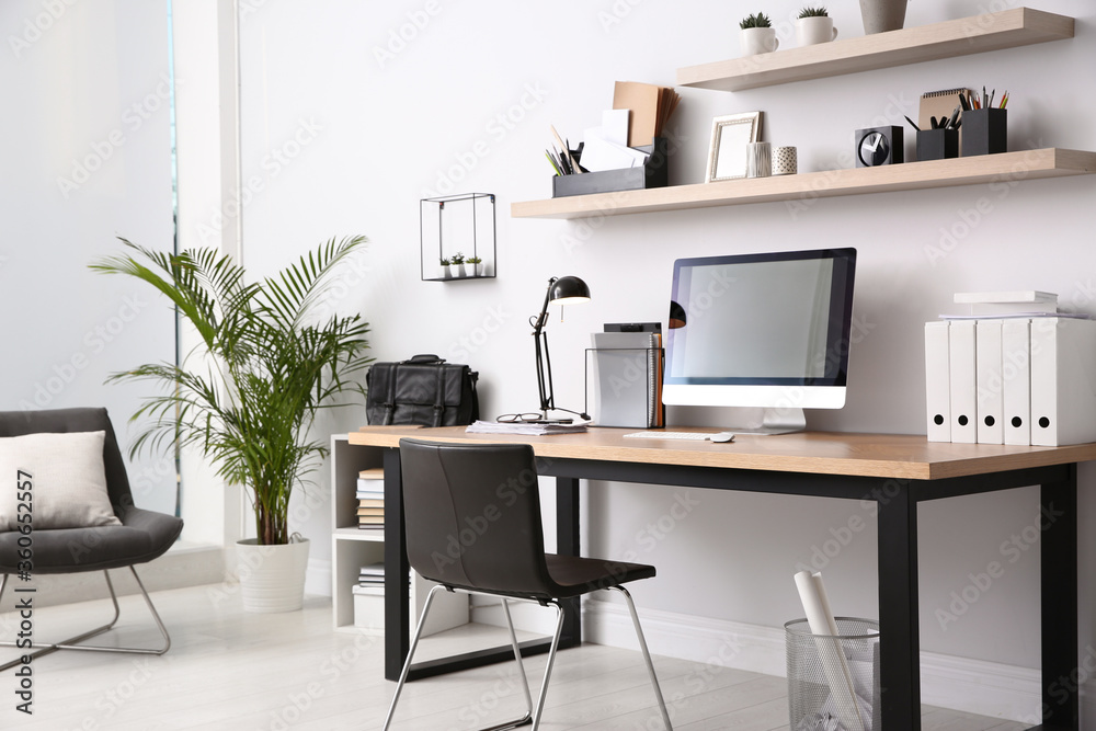 Fototapeta premium Modern computer on table in office interior. Stylish workplace
