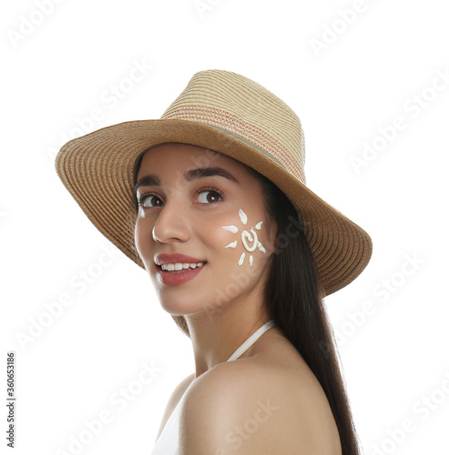 Young woman with sun protection cream on her face against white background