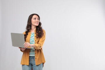 Young woman with laptop on white background