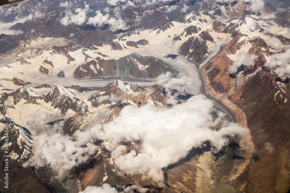 Beautiful sandstone Himalayan mountains with snow. View from the airplane of Leh - Ladakh, Northern India. Beautiful sandstone Himalayan mountains with snow. View from the airplane of Leh - Ladakh, Northern India.