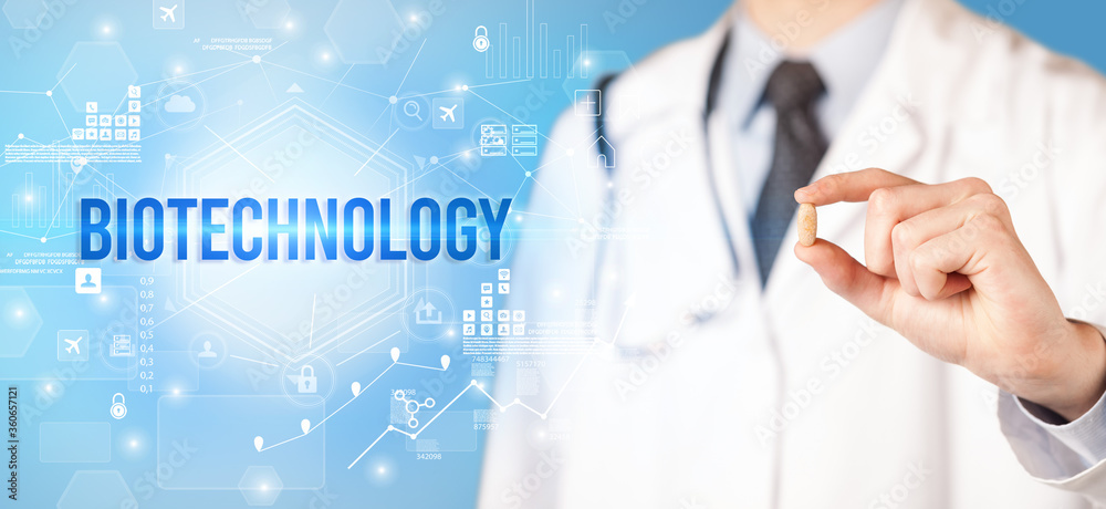 Doctor giving a pill with BIOTECHNOLOGY inscription, new technology solution concept Doctor giving a pill with BIOTECHNOLOGY inscription, new technology solution concept