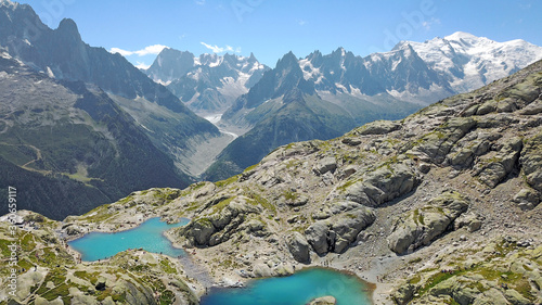 Grandes Jorasses and Mer de Glace behind the turquoise water of the Lac Blanc in Chamonix. photo
