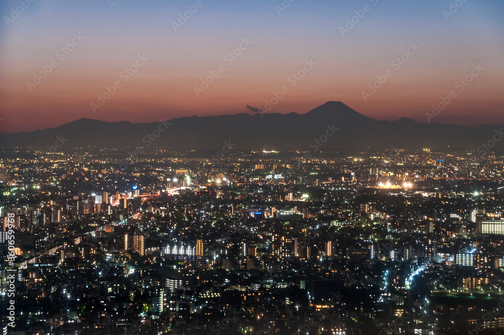 Mount Fuji looking out over Tokyo after sunset.
