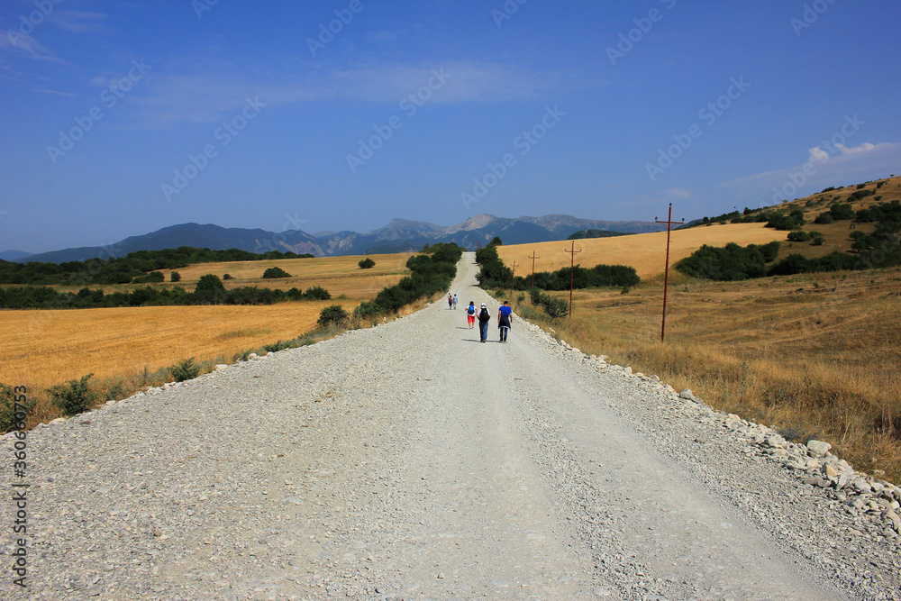 Azerbaijan. Tourists walking along the road. Azerbaijan. Tourists walking along the road.