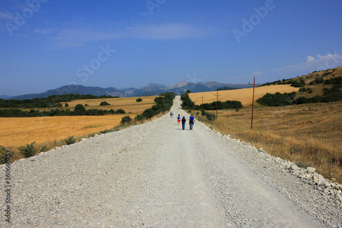 Azerbaijan. Tourists walking along the road.