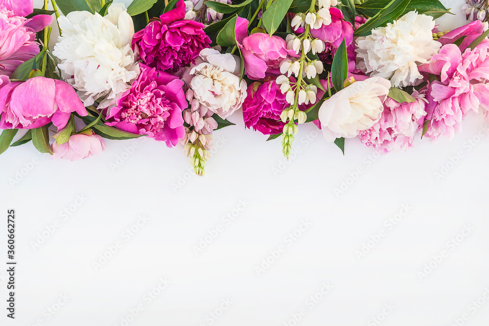 Beautiful floral frame of bunch of purple, pink, and white peonies on white background. Space for text, flat lay Beautiful floral frame of bunch of purple, pink, and white peonies on white background. Space for text, flat lay
