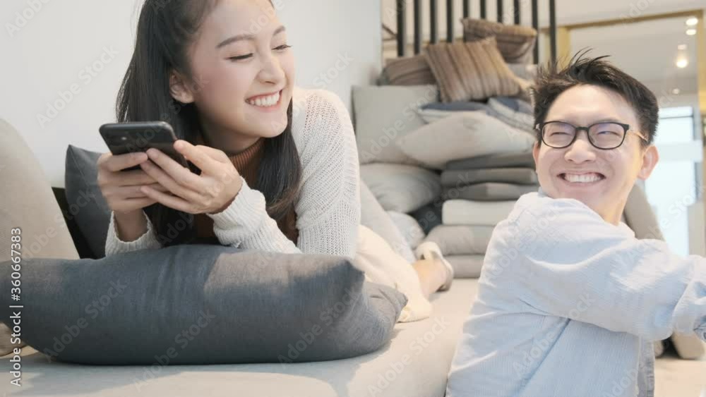 asian marry sweet romance couple family both enjoy pravate technology smartphone and laptop together in living room new city lifestyle ideas concept asian marry sweet romance couple family both enjoy pravate technology smartphone and laptop together in living room new city lifestyle ideas concept