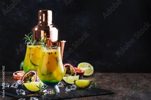 Summer drink with passion fruit  lime  syrup and rosemary alcoholic cocktail or lemonade