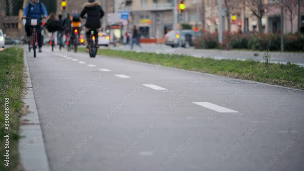 Video of traffic of cyclists on the bicycle lane in the city. Video of traffic of cyclists on the bicycle lane in the city.