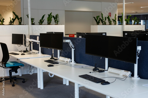 Fototapeta Naklejka Na Ścianę i Meble -  Empty work stations in a modern open space office