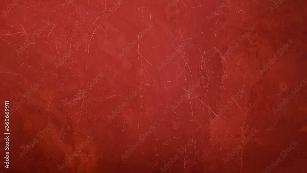 red gradient plaster concrete wall background. aged wall with scratched and holes but seem smooth. Christmas holiday background red. 