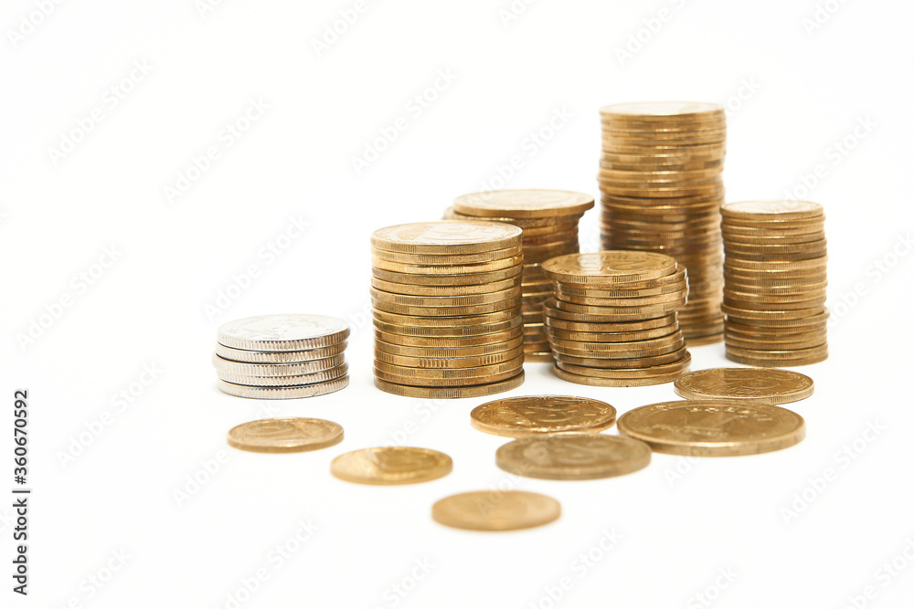 Stacks of coins on a white background. Stacks of coins on a white background.