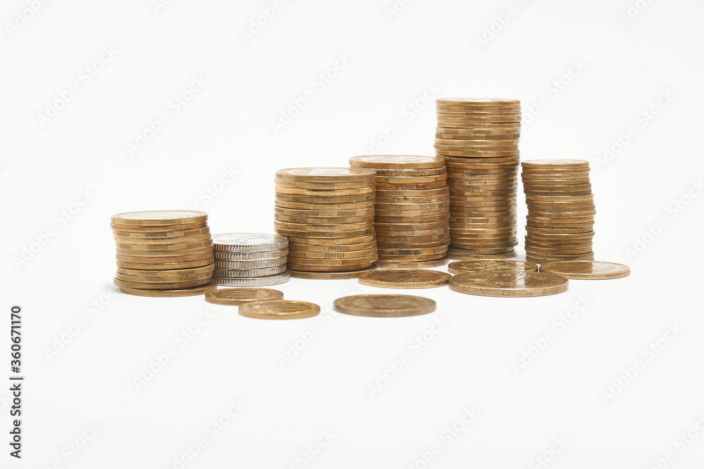 Stacks of coins on a white background. Stacks of coins on a white background.