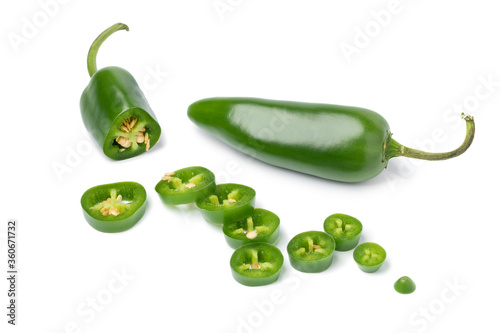 Fresh green jalapeno peppers and slices photo