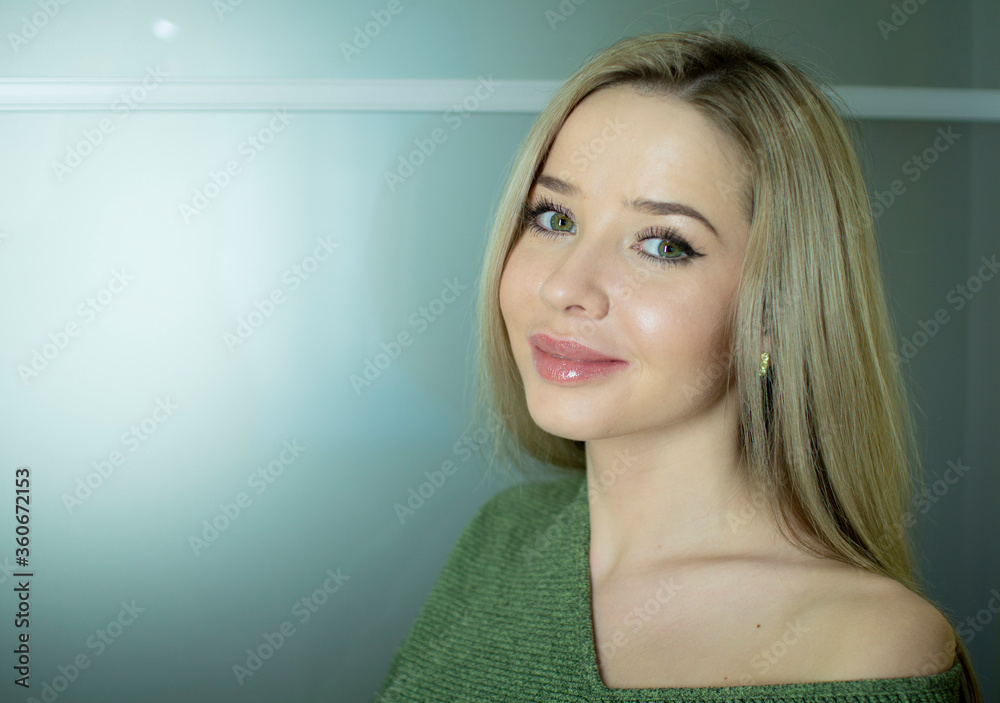 Portrait of a beautiful young woman. A girl with healthy long blond hair. Portrait of a beautiful young woman. A girl with healthy long blond hair.