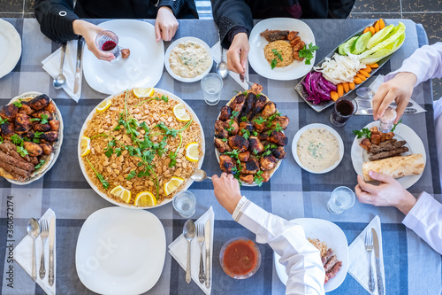 happy muslim family eating togther