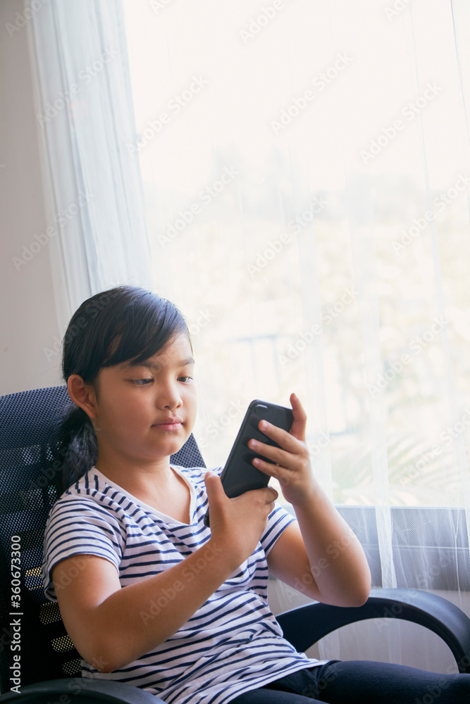 Little girl using smartphone for video call