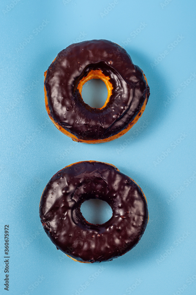 Two Donuts on blue background Two Donuts on blue background
