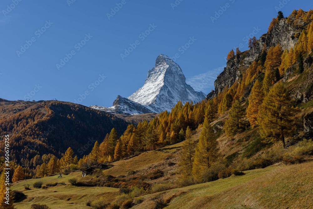 The matterhorn mountain landscape with snow in Autumn season