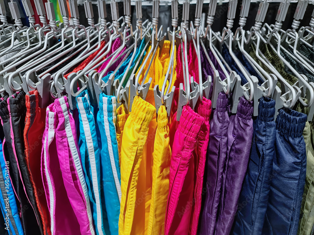 Collection of Hanging Colorful Shorts at Clothing Store