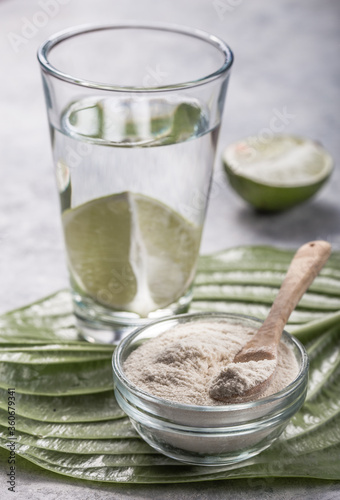 Collagen Powder and glass of water with slice of Lime; Vitamin C . Collagen supplements may improve skin health by reducing wrinkles and dryness.