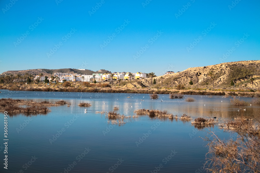Lake of Palomares with the towm in background near of the Vera Playa, Andalusia, Spain