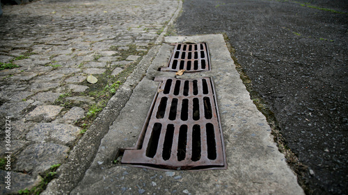 salvador, bahia / brazil - june 27, 2020: manhole grating for rainwater drainage is seen in a condominium in the city of Salvador.  photo