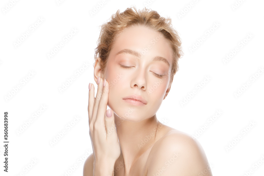 Beauty portrait of young beautiful blond woman face, eyes closed, touching her perfect clean skin with hand, isolated on white background Beauty portrait of young beautiful blond woman face, eyes closed, touching her perfect clean skin with hand, isolated on white background