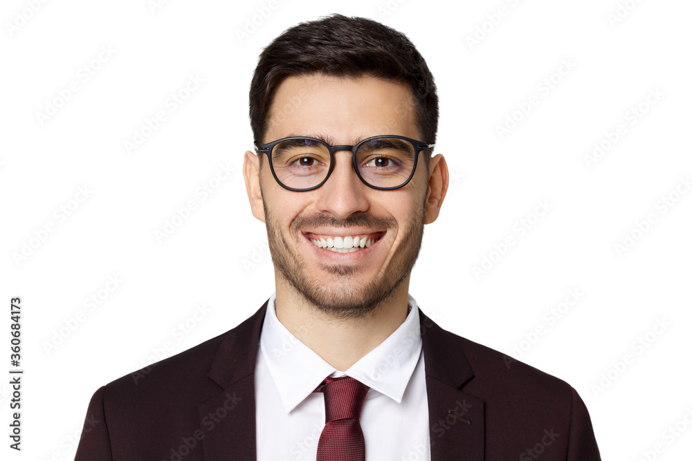 Headshot of handsome business man isolated on gray background with stylish eyeglasses on, showing happy friendly smile Headshot of handsome business man isolated on gray background with stylish eyeglasses on, showing happy friendly smile