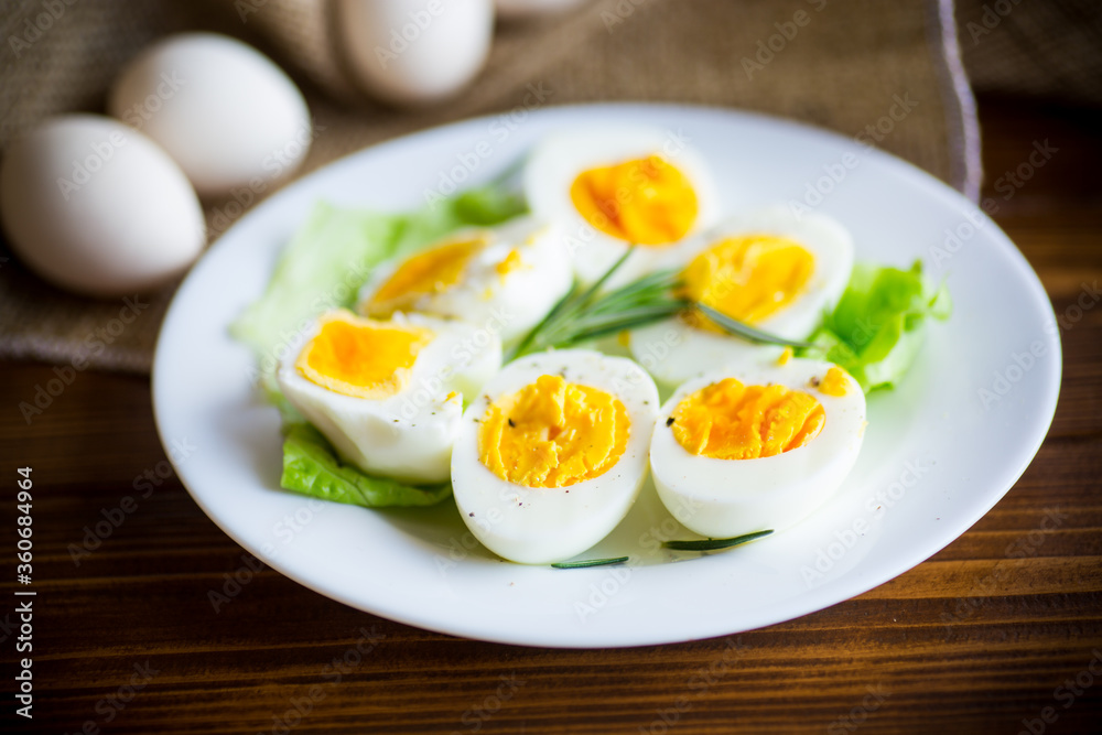 boiled eggs with salad leaves in a plate boiled eggs with salad leaves in a plate