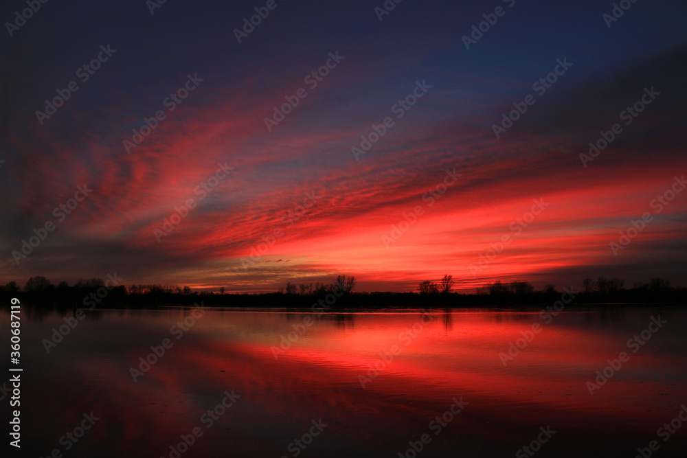 Colorful sunset by the Odra River, Poland.