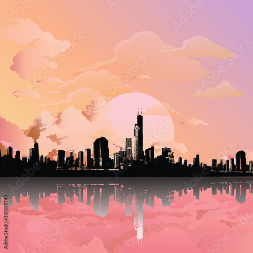 Stunning sunrise or dawn over silhouetted generic city skyline reflected in foreground 