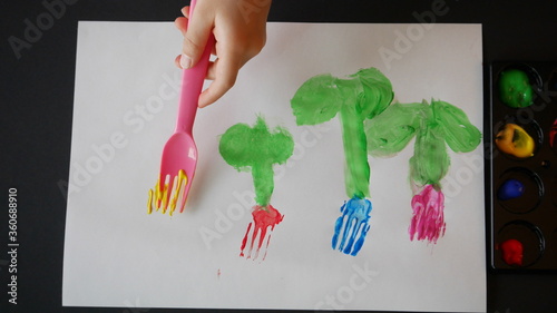 A child drawing tulips as a fork art