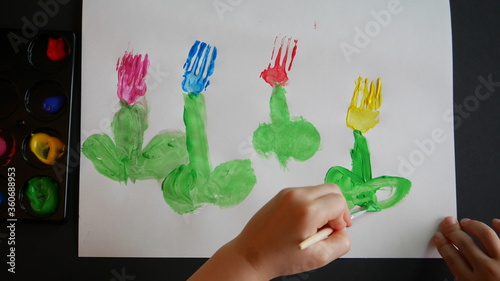 A child drawing tulips as a fork art