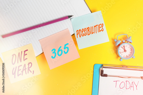 Handwriting text writing One Year, 365 Possibilities. Conceptual photo Fresh graduates start Opportunities New career Flat lay above table with blank papers with copy space for text messages photo