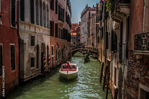 Amazing view on the beautiful Venice, Italy. Many gondolas sailing down one of the canals. © Munteanu