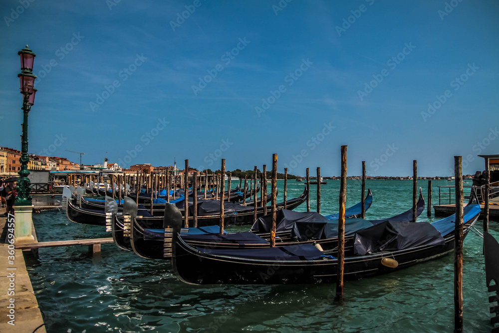 Gondolas moored by Saint Mark square in Venice, Italy