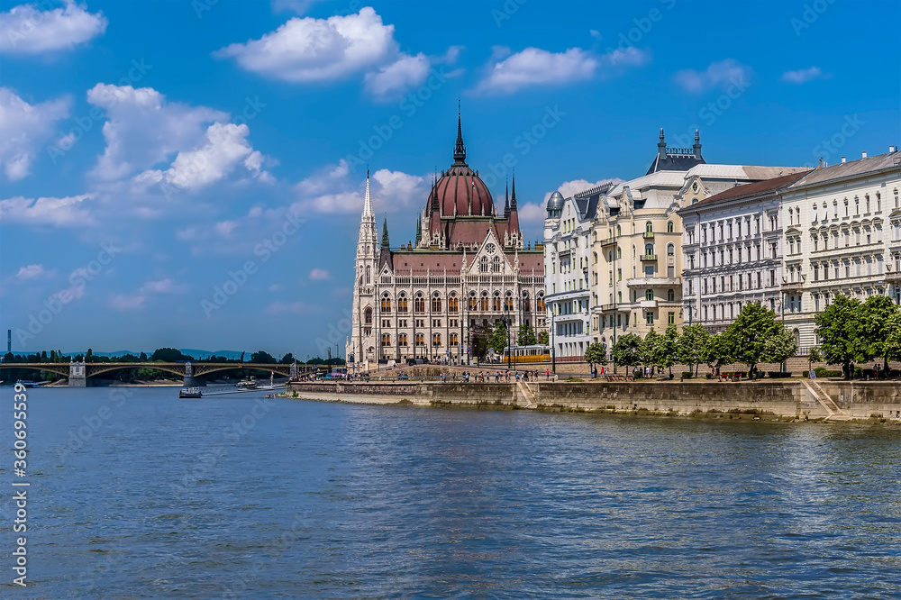 A view of the east bank of the River Danube in Budapest from a boat on the river during summertime