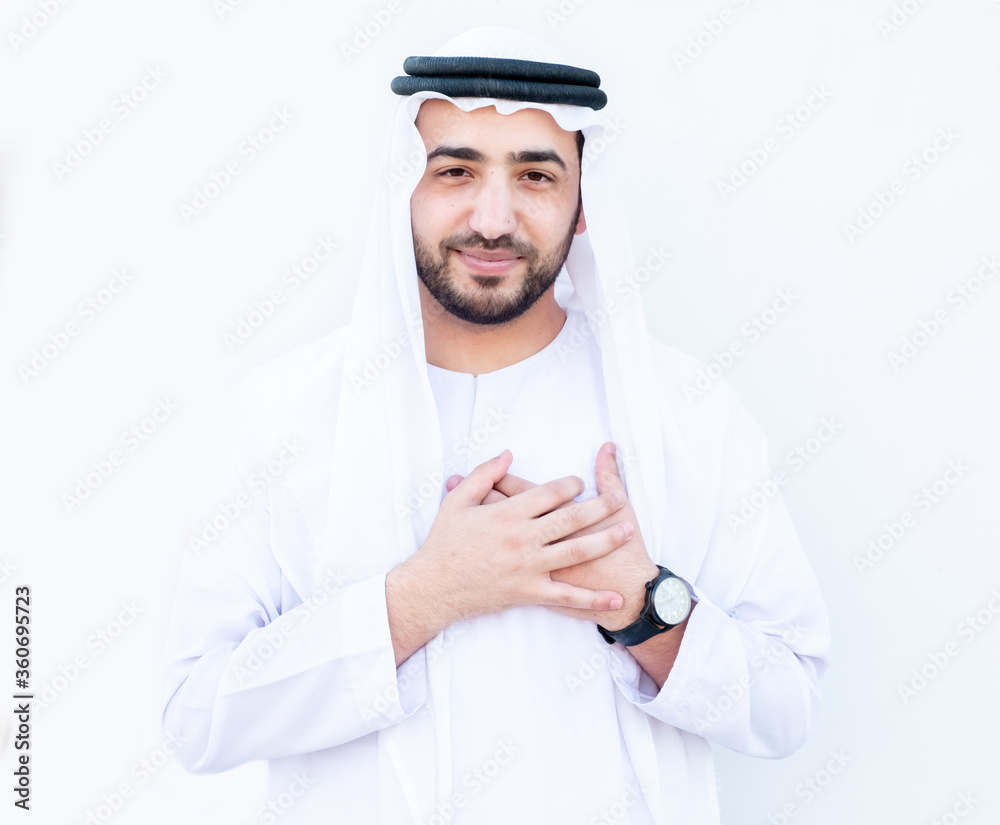 Arabic man feeling his heart beat by his hands Arabic man feeling his heart beat by his hands