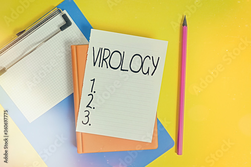 Handwriting text writing Virology. Conceptual photo branch of science dealing with the variety of viral agents and disease Pile of empty papers with copy space on the table photo