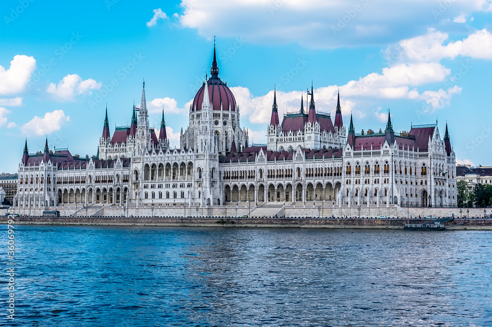 A view looking north of the Parliament building on the eastern shore of the River Danube in the summertime