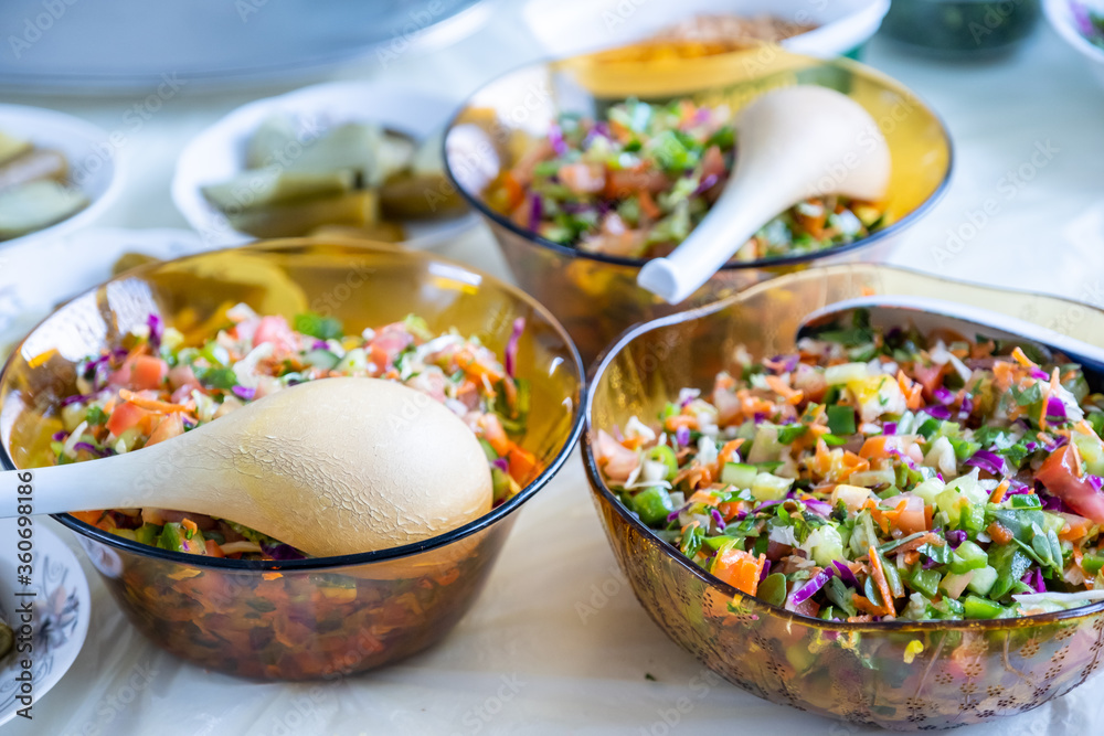 Bowls filled with sald on table Bowls filled with sald on table