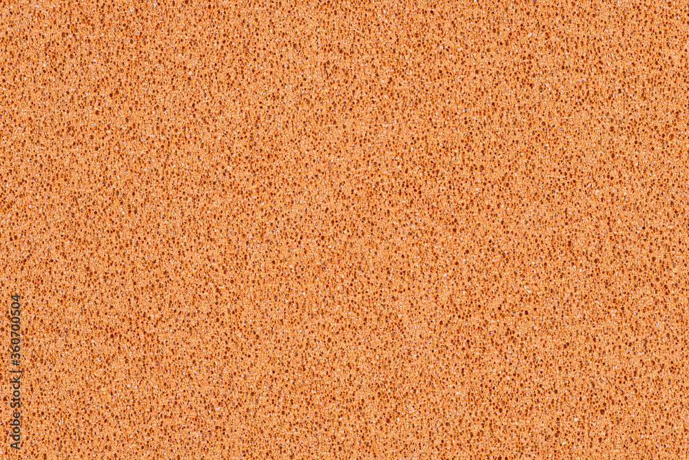 A macro photo of a brown gradient color with texture from real foam sponge paper for background, backdrop or design. A macro photo of a brown gradient color with texture from real foam sponge paper for background, backdrop or design.