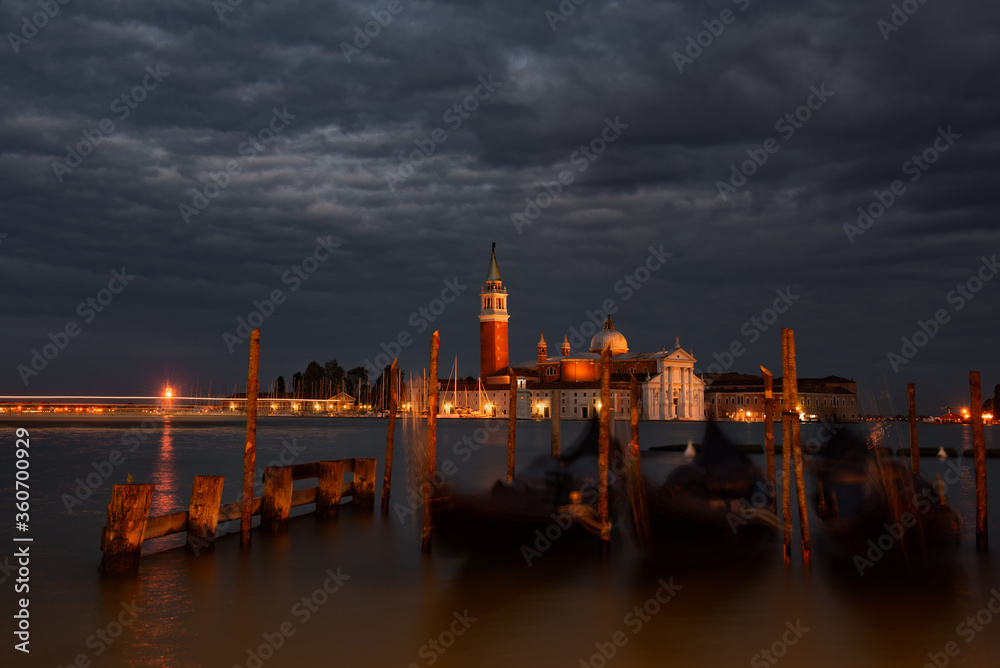 Church of San Giorgio Maggiore at night with city lights, Venice