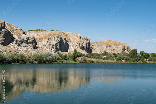 landscape of rocks and water in the lagoon of the campillo in Rivas Vaciamadrid in Madrid Spain