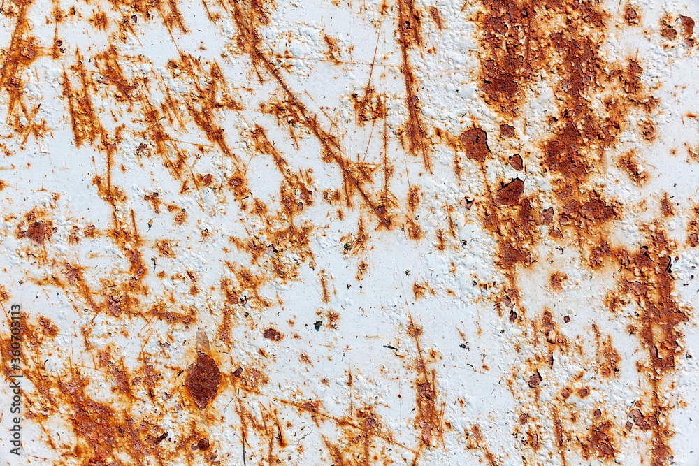 Rusty metal texture with cracked white paint